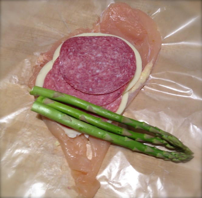 Place ingredients more toward the bottom before you roll the chicken