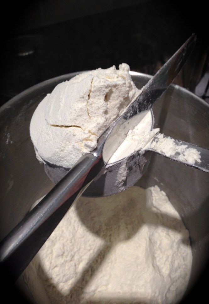 Use a knife to level off the flour...