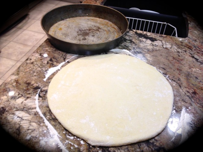 Roll out the dough to a quarter of an inch to cover the bottom and sides...