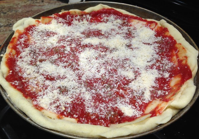 Top with sauce, seasonings and parmesan/romano mixture...