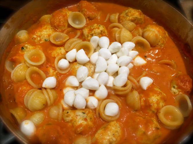 Adding Mozzarella Pearls To The Sauce