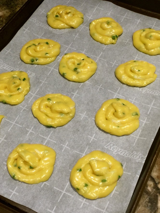 batter piped on to a baking sheet
