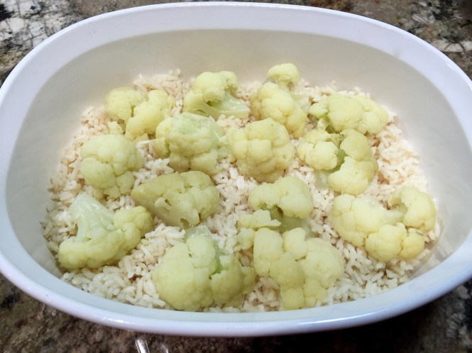 Put the cauliflower florets on top of the rice