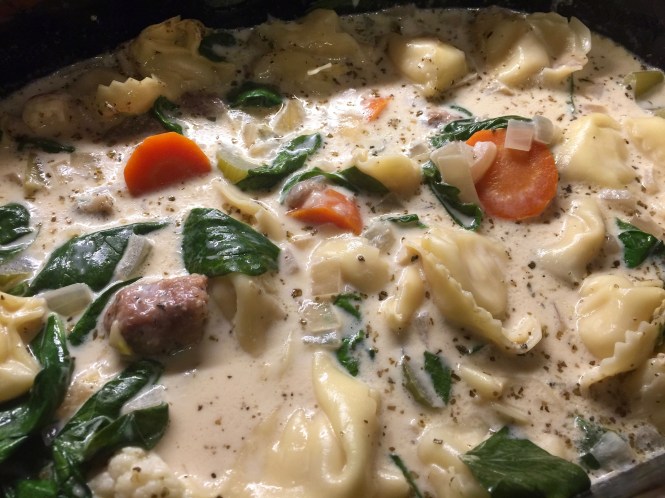 Add the evaporated milk and spinach